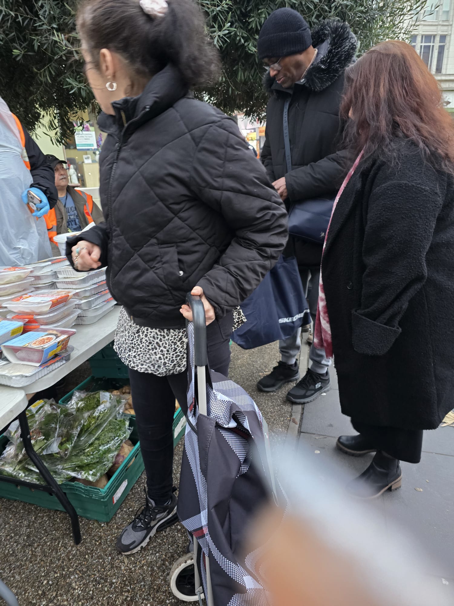 December 2025 Food Distribution - Community volunteers serving meals and fresh produce