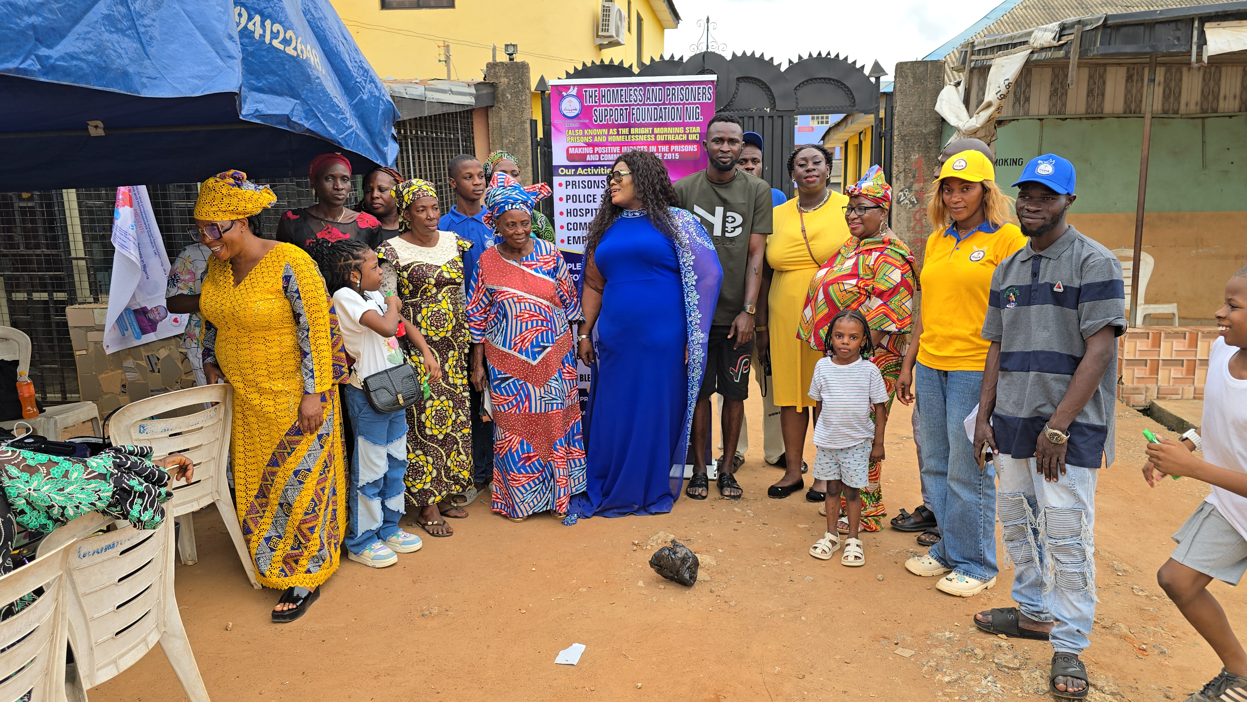 Large community gathering with mission team and local residents